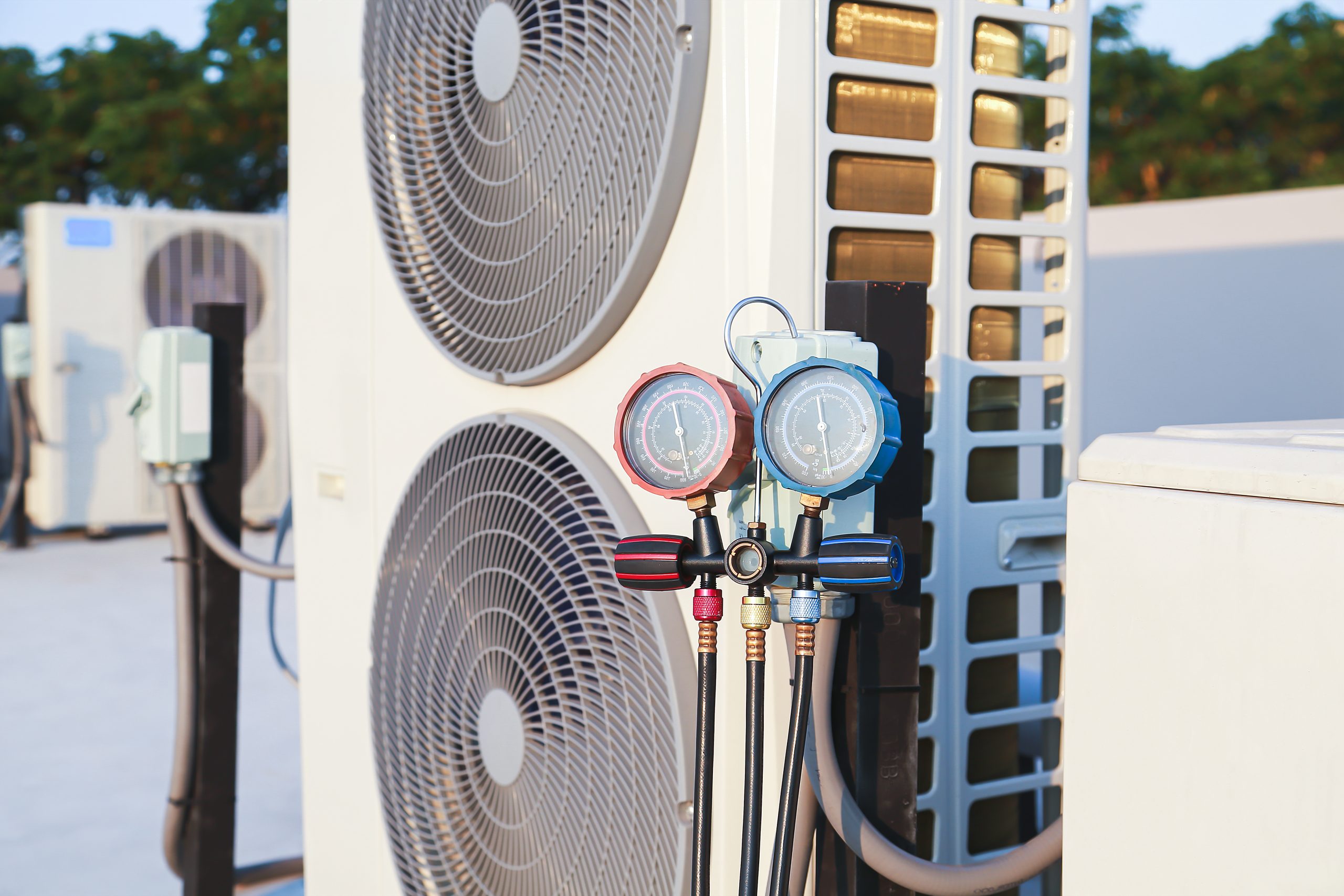 air conditioner technician checks operation industrial air conditioners scaled